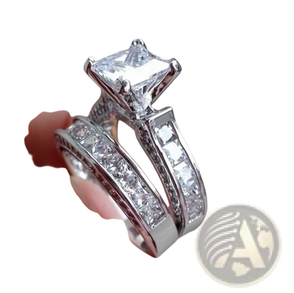A sparkling silver princess cut cz engagement ring set with a square diamond center stone and matching bands