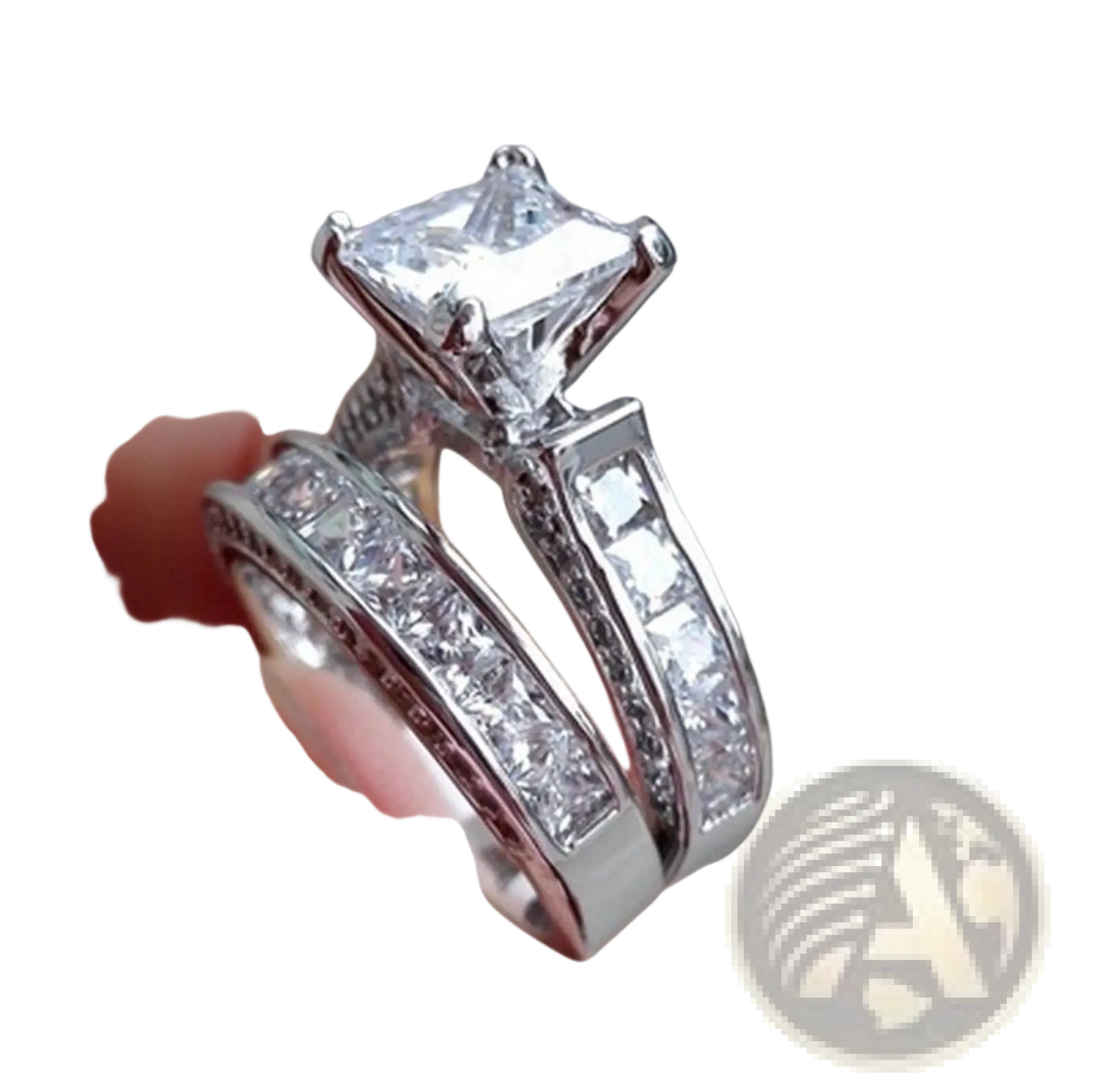 A sparkling silver princess cut cz engagement ring set with a square diamond center stone and matching bands