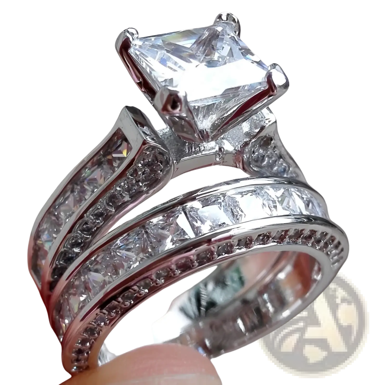 A sparkling silver couple anniversary ring set featuring a princess cut cz center stone with channel and pavé diamonds