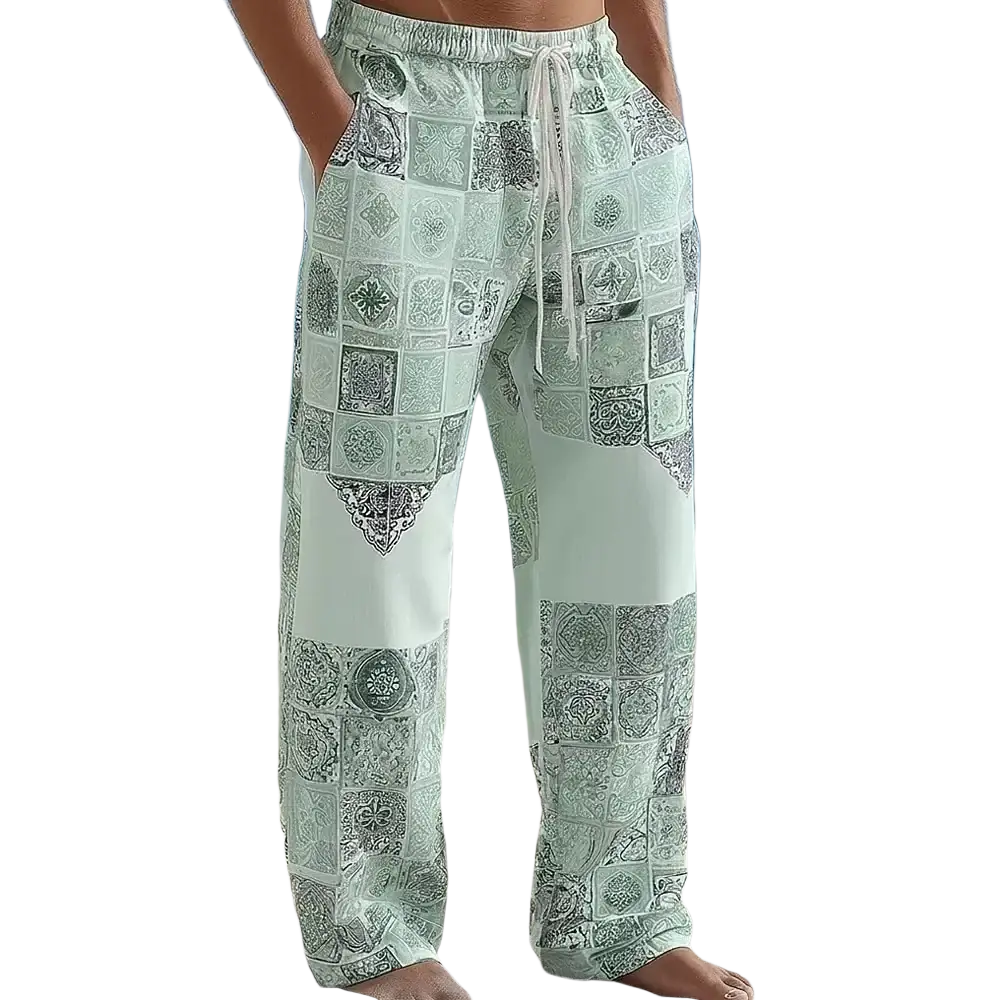 Light green printed casual drawstring trousers with wide-leg cut and intricate black and gray patchwork designs