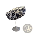 Black and white damask-patterned printed korean style fabric fashion cap displayed on a stand