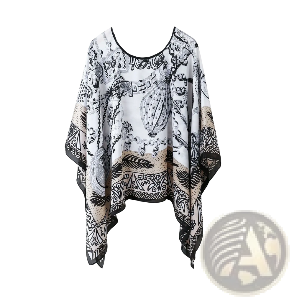 Printed silk patterned pullover shawl cape outerwear in white black and beige with intricate tribal-inspired designs