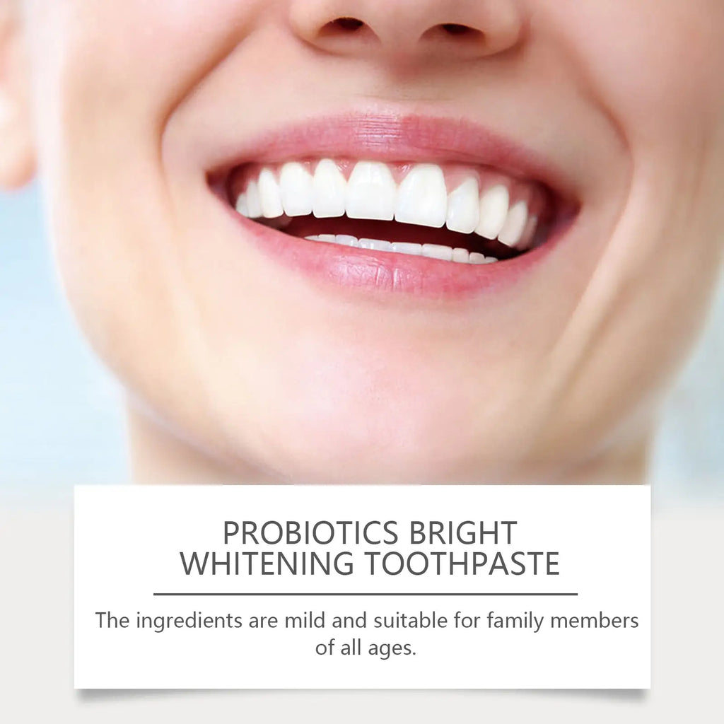 A close-up of a bright white smile with pink lips showcasing probiotic brightening toothpaste with peppermint extract