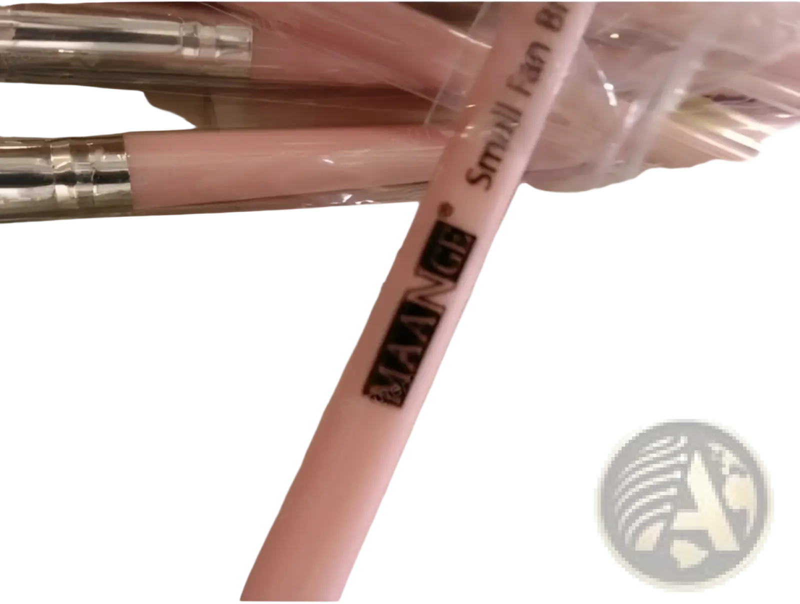 Pink maange small fan brush with silver ferrule in clear plastic packaging from professional 12 pcs eyeshadow brush set