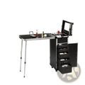 Professional black metal makeup train case with adjustable legs multiple drawers and built-in bluetooth speaker
