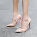 Beige patent leather pointed toe stiletto pumps with slender high heels for elegant formal wear