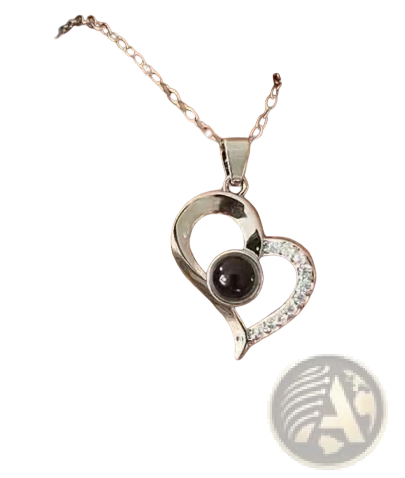 Silver projection heart necklace with black spherical centerpiece and clear stones on delicate chain with rose gift box