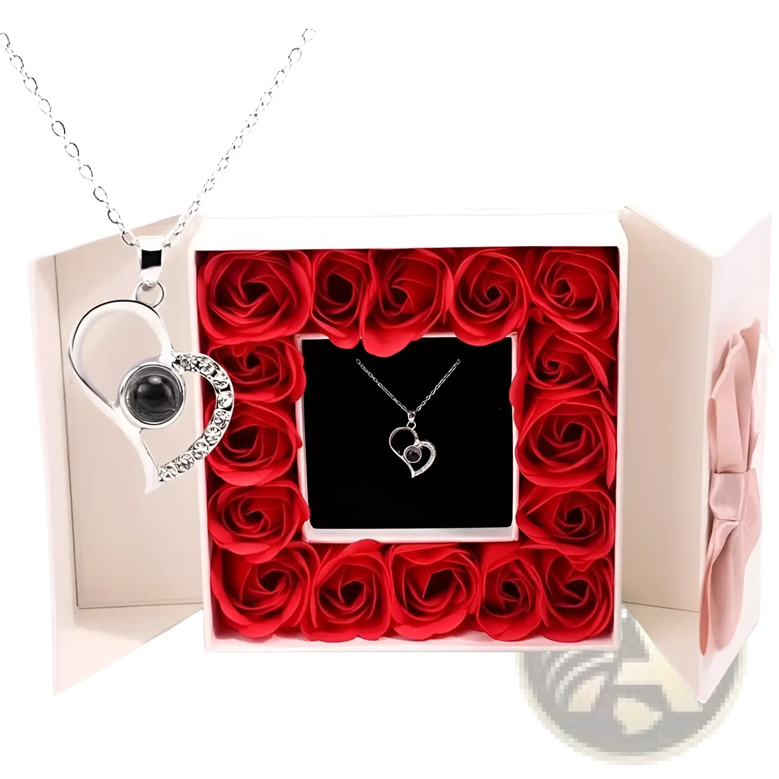 Silver heart-shaped projection necklace with black gemstone and rhinestones in gift box surrounded by red roses