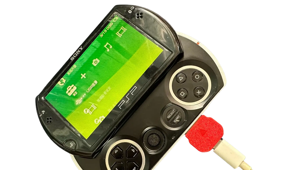 Black sony psp go handheld gaming console with green screen displaying icons and playstation logo for psp go type c converter charging cable accessory
