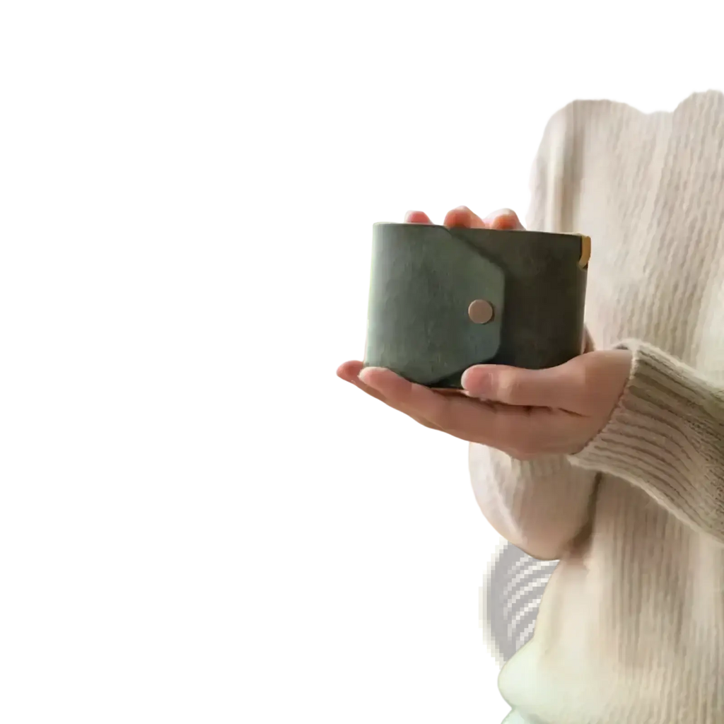 A sleek dark green pu leather card holder wallet with minimalist flap closure and a single brass button