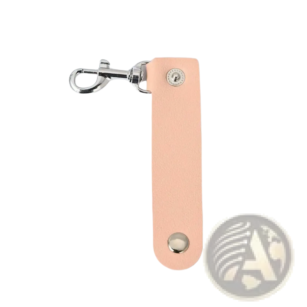 A sleek peach-colored pu leather keychain with silver metal clasp and decorative studs for anti-lost car keys