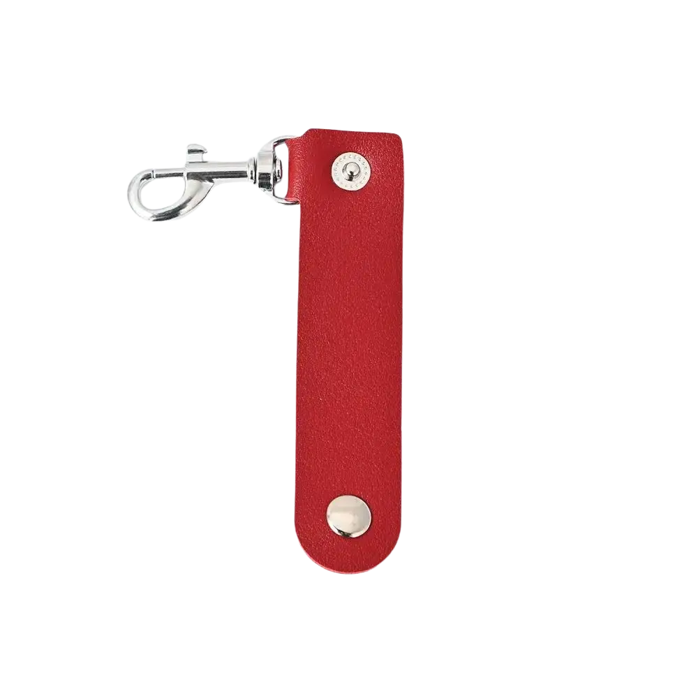 Red pu leather keychain with silver metal clasp and two circular studs designed as an anti-lost car key strap pendant