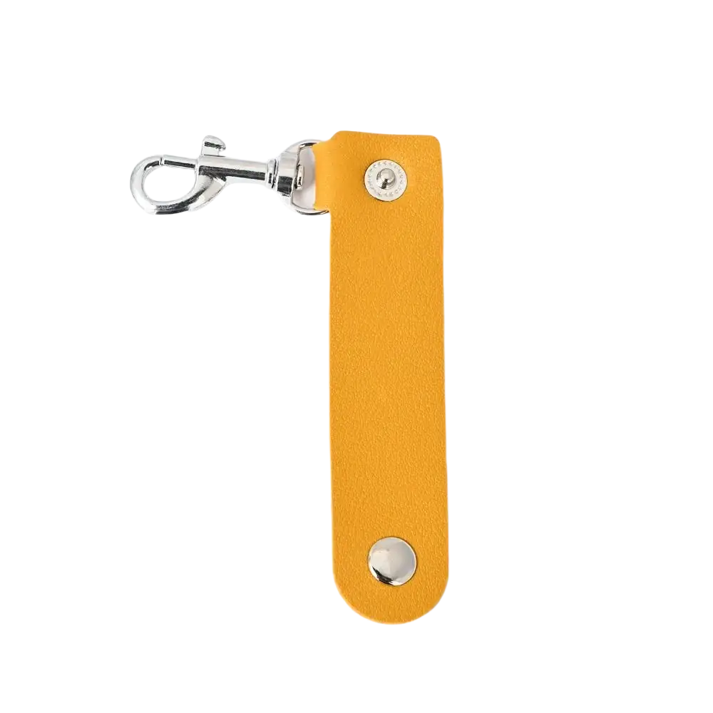 A sleek mustard-yellow pu leather keychain with a polished silver clasp and two matching circular studs for anti-lost use