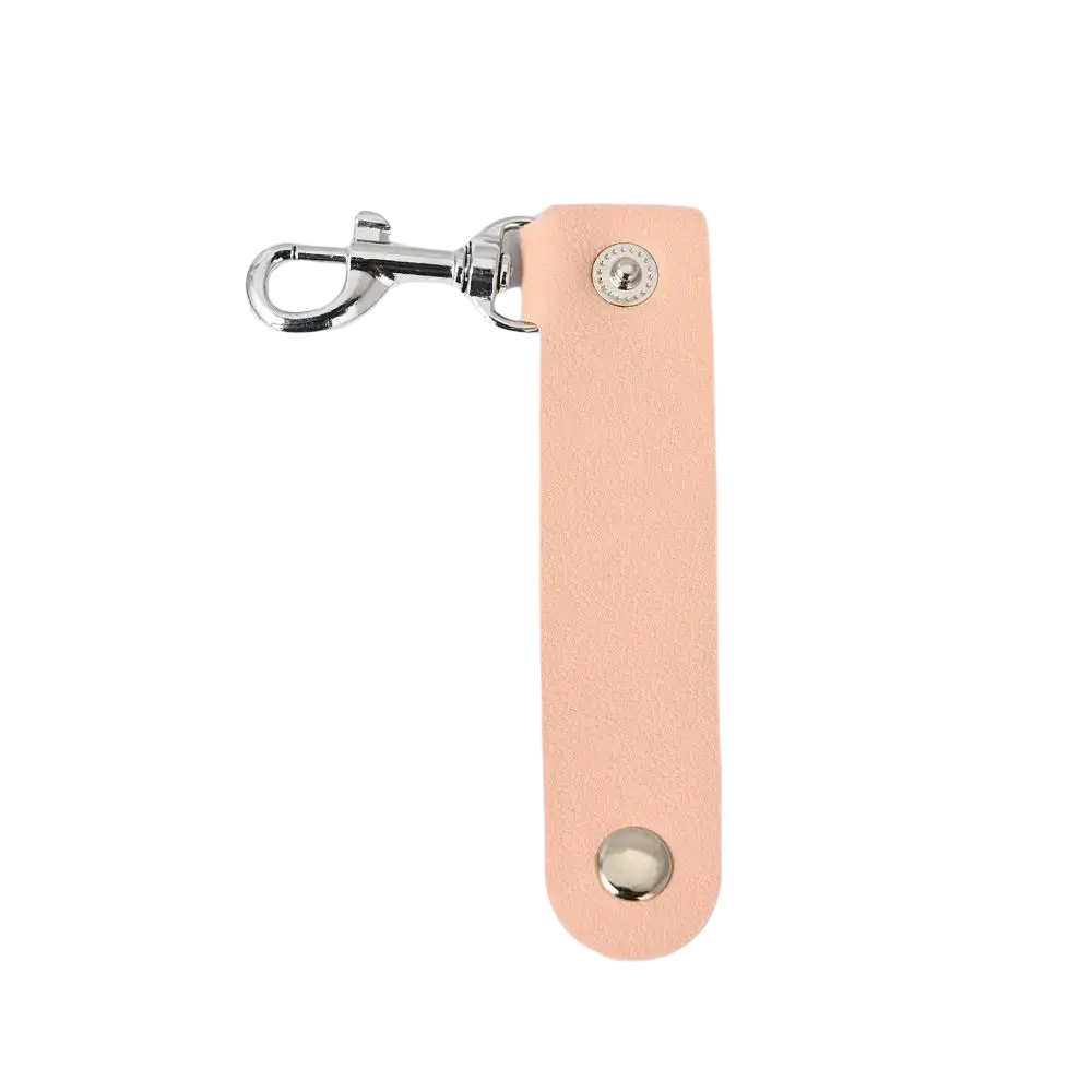 A sleek peach-colored pu leather keychain with silver metal clasp and decorative studs for anti-lost car keys