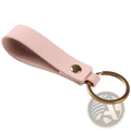 A soft pink pu leather keychain with a gold-toned metal ring and snap button for secure key organization