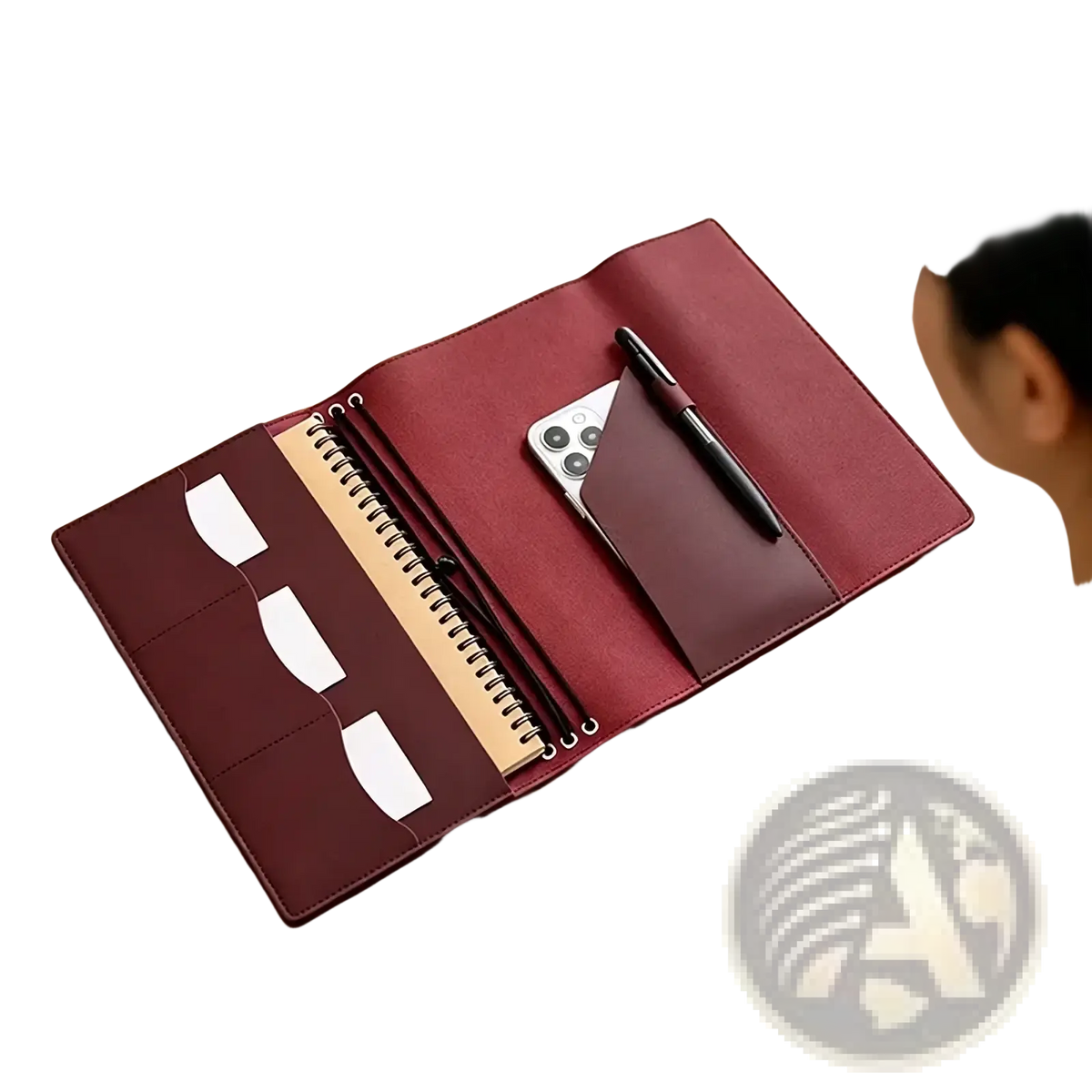 A burgundy pu leather refillable travel journal cover planner with multiple compartments and spiral notebook slot