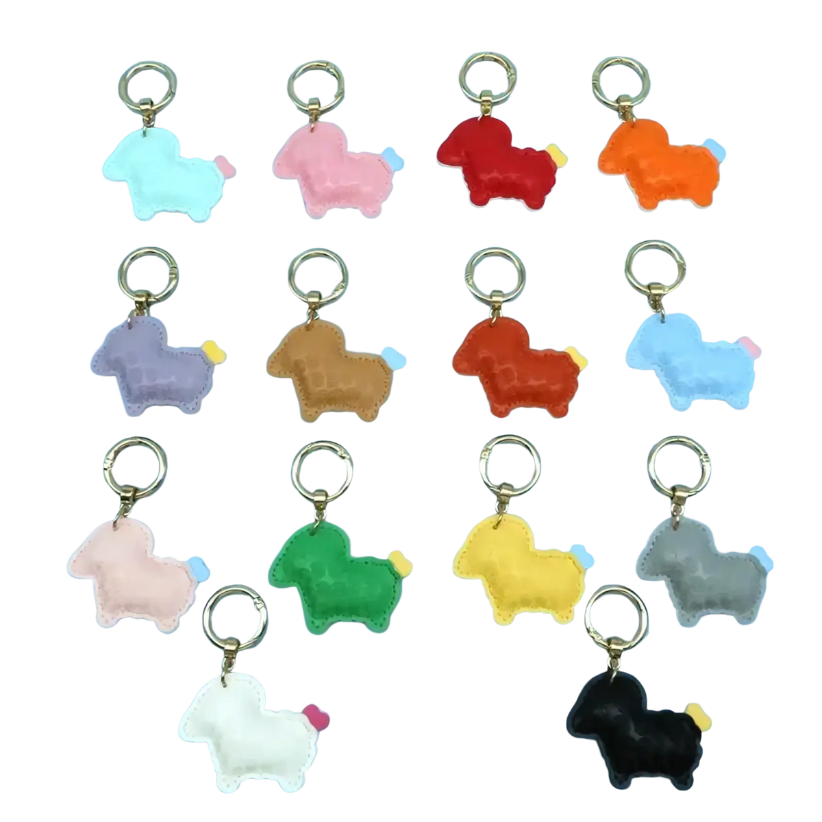 A collection of colorful plush pu leather sheep keychain bag charms with gold-toned metal rings