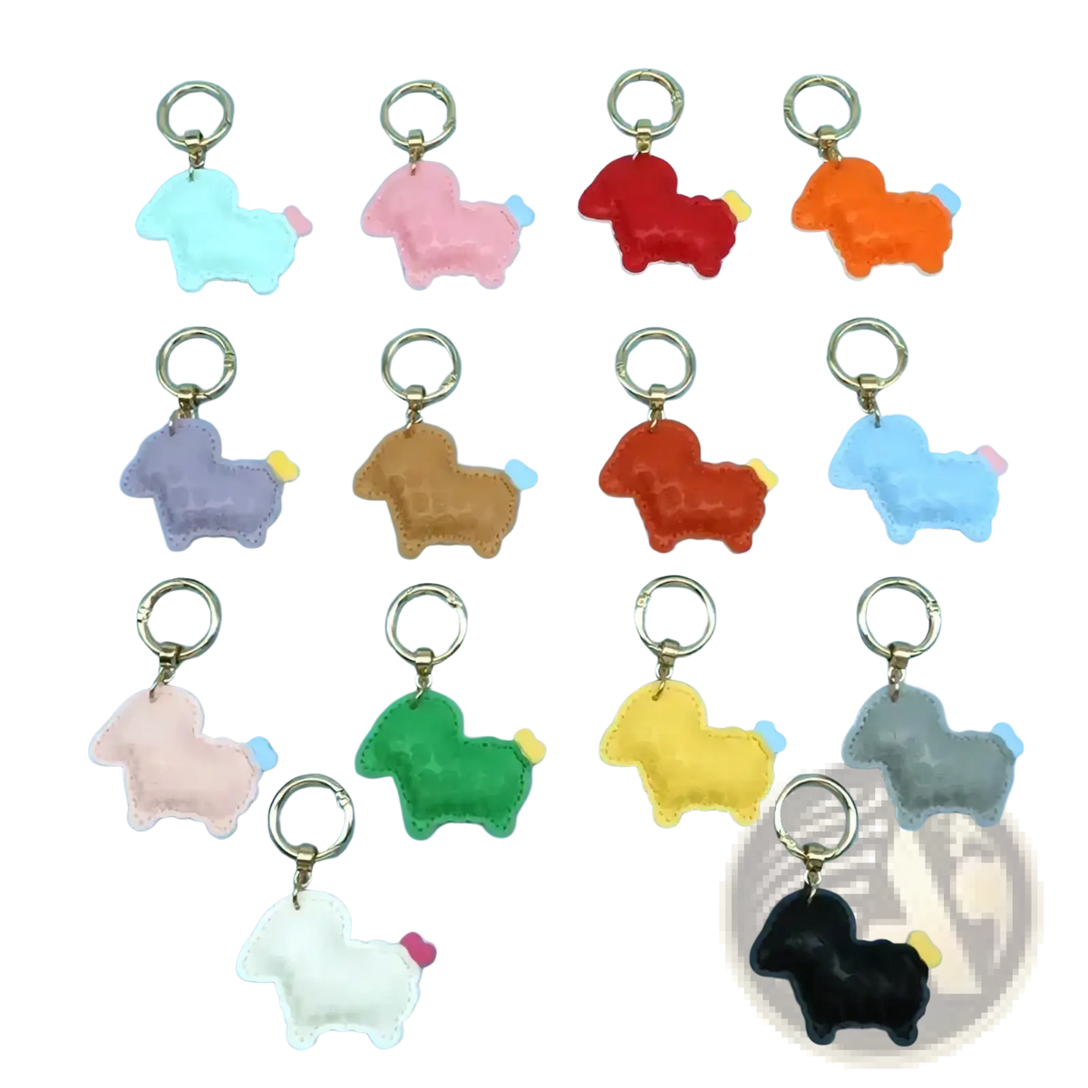 A collection of colorful plush pu leather sheep keychain bag charms with gold-toned metal rings