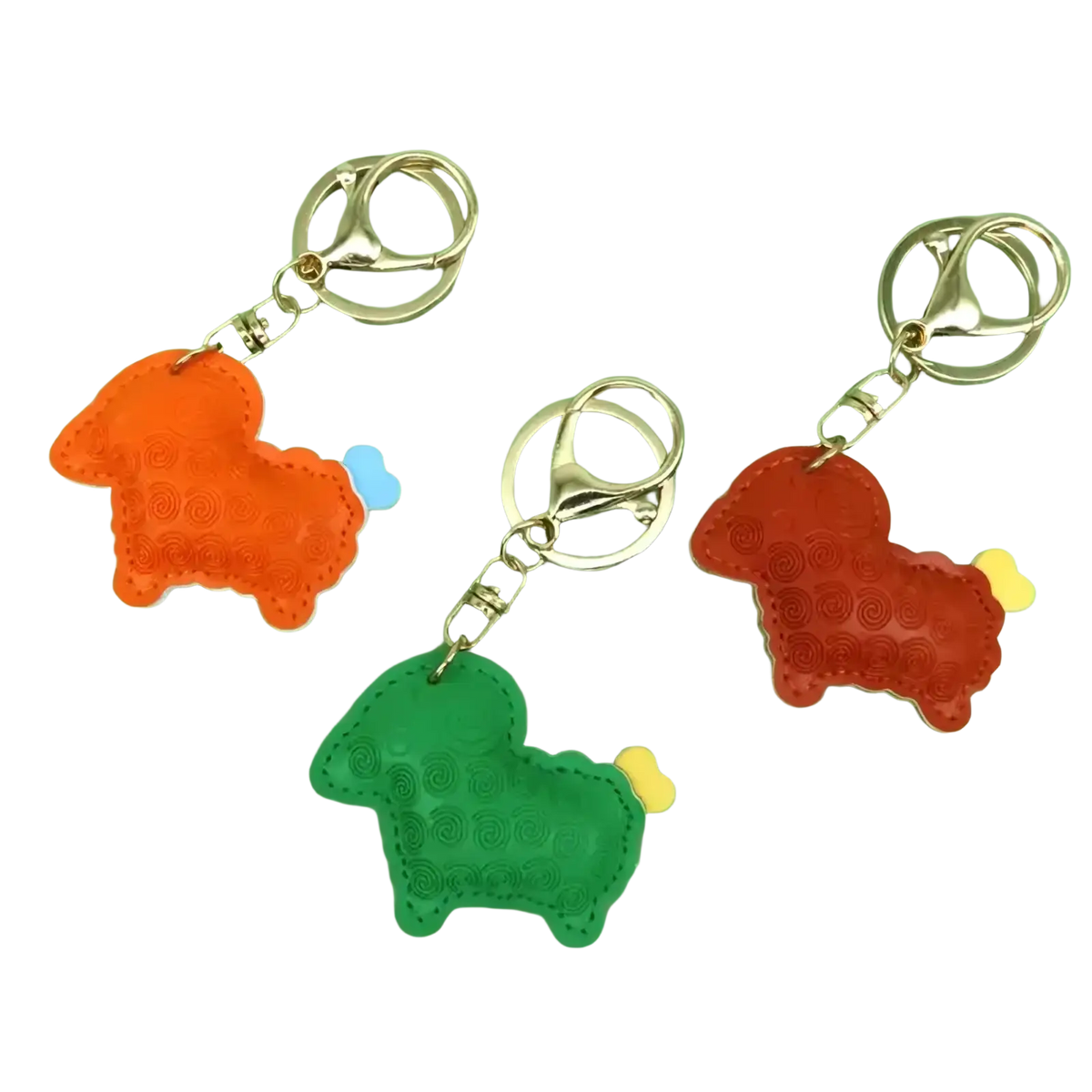Pu leather sheep keychain bag charm in orange green and red leather with stitched details and bone shaped tails
