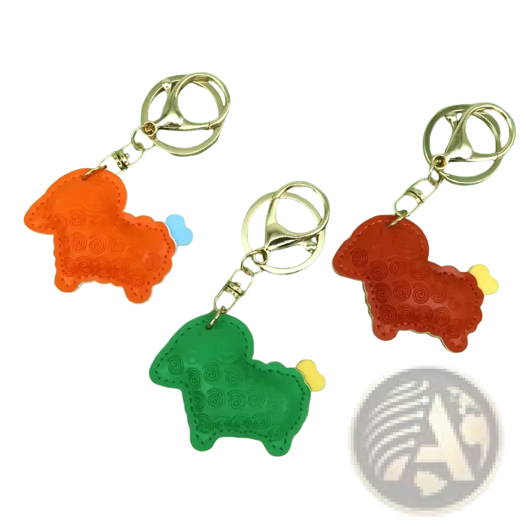 Pu leather sheep keychain bag charm in orange green and red leather with stitched details and bone shaped tails