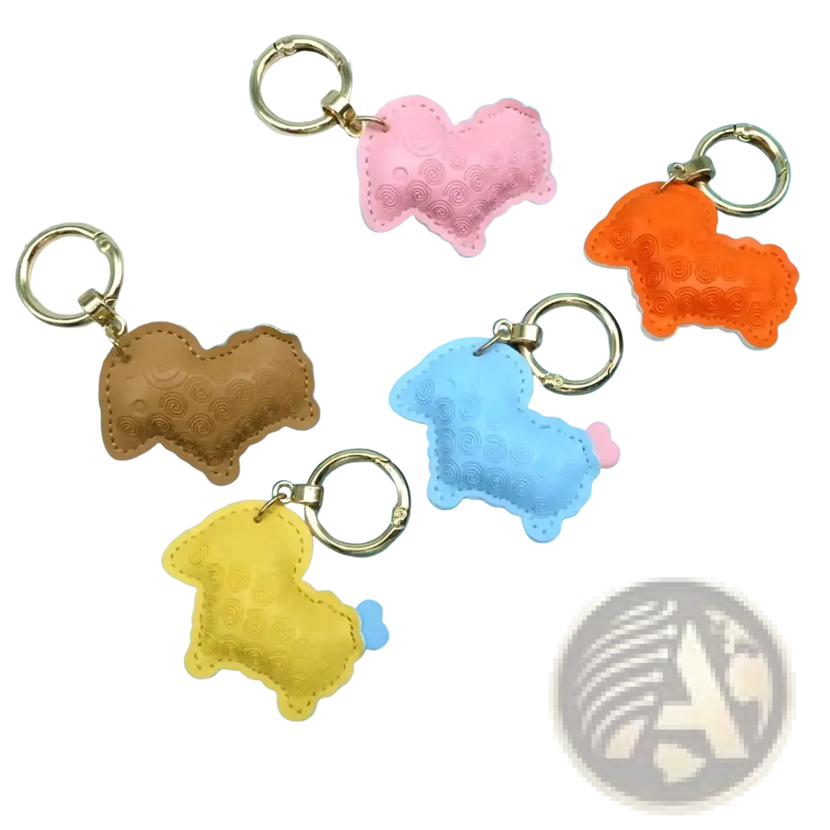 Pastel-colored pu leather sheep keychain bag charms with textured surfaces and gold-toned metal rings