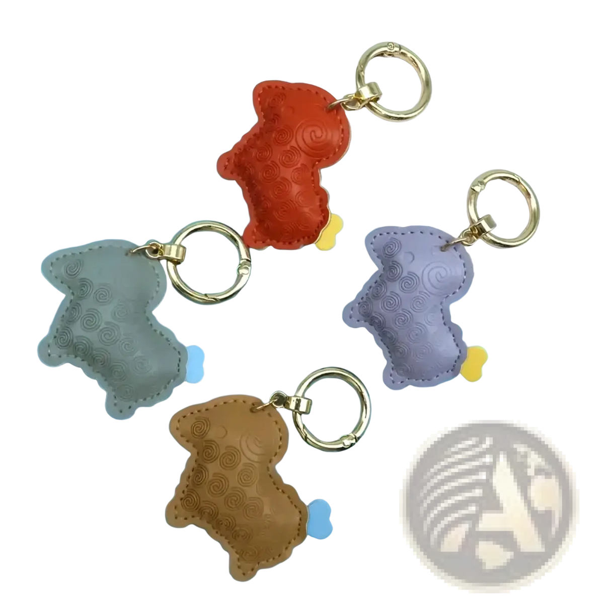 A set of four colorful pu leather sheep keychain bag charms embossed with dog shapes in gray orange purple and brown