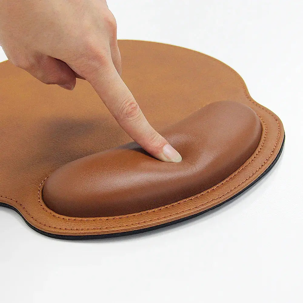 Brown ergonomic pu leather mouse pad with contoured wrist support for comfortable office use