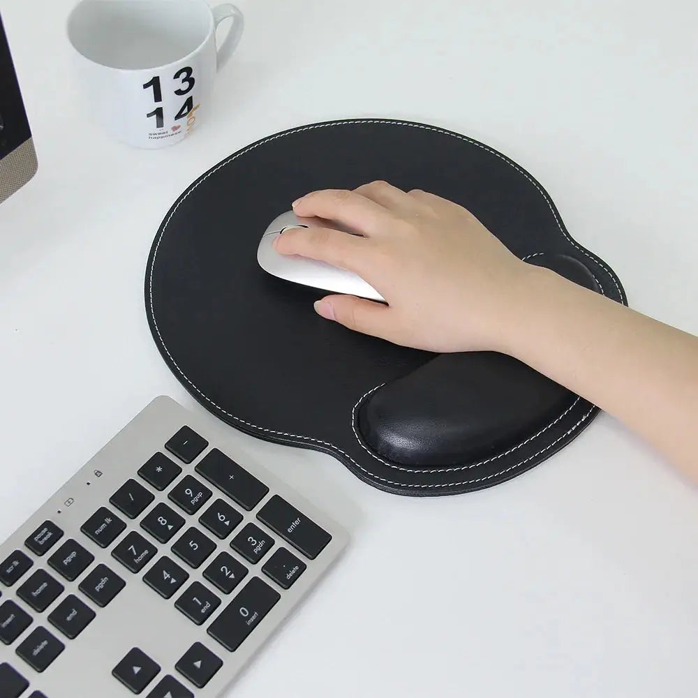 Black ergonomic pu leather mouse pad with stitched edges and built-in wrist support for comfort and durability