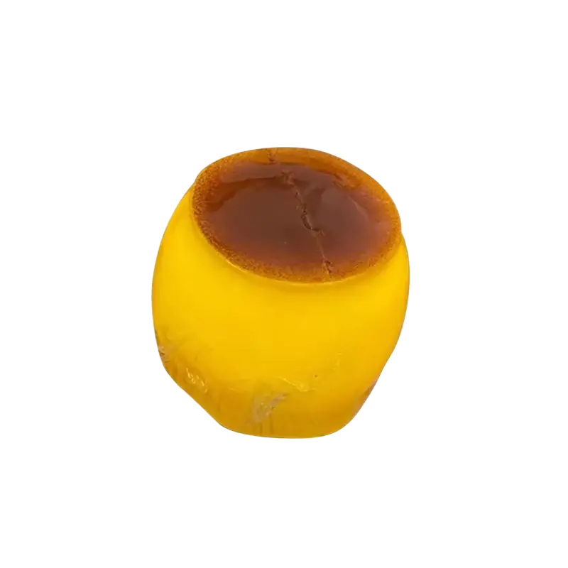 Pudding squishy asmr stress relief toy resembling golden-yellow translucent caramel custard with glossy brown top