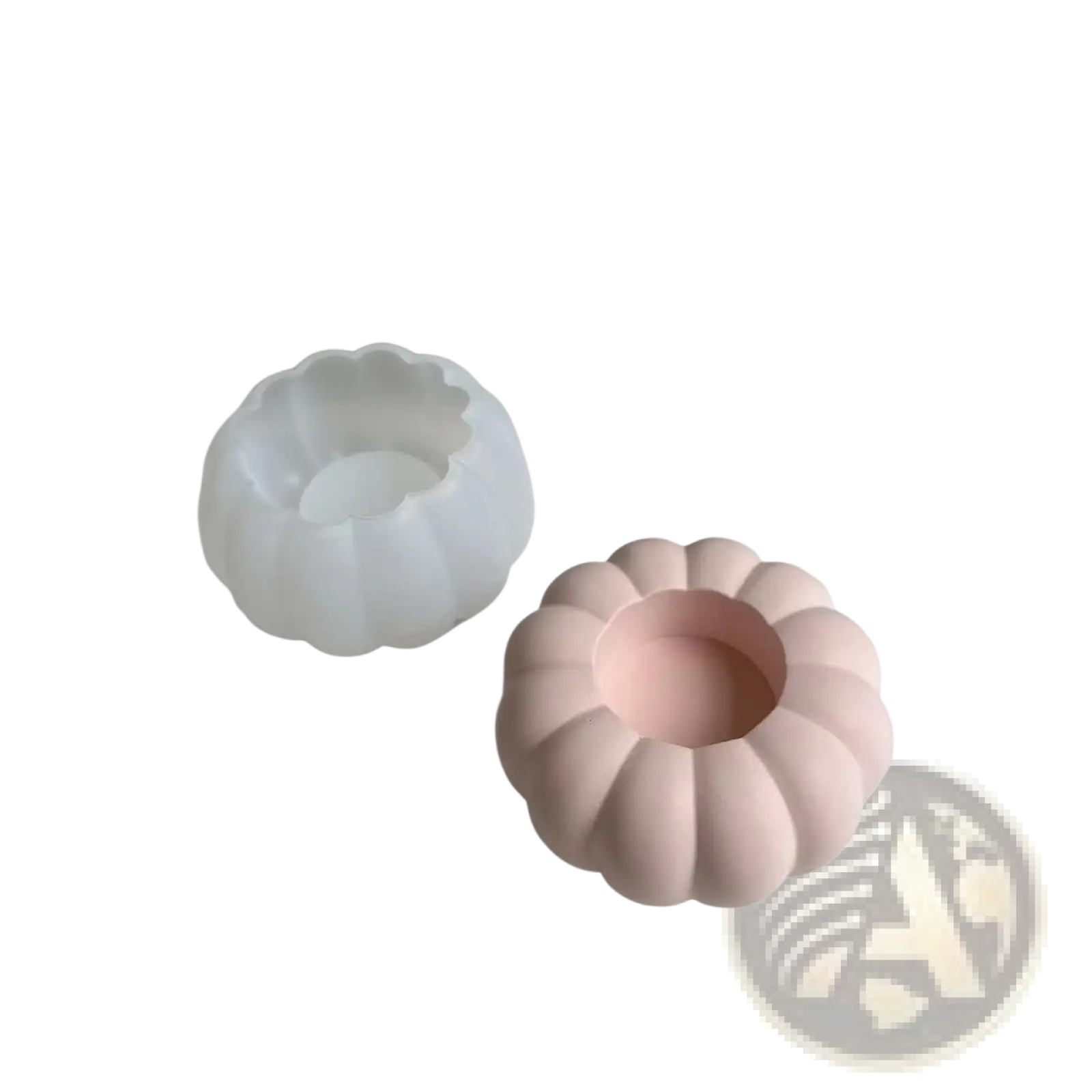 Pink pumpkin-shaped ceramic candle holder made using silicone mold T289 for decorative lighting purposes