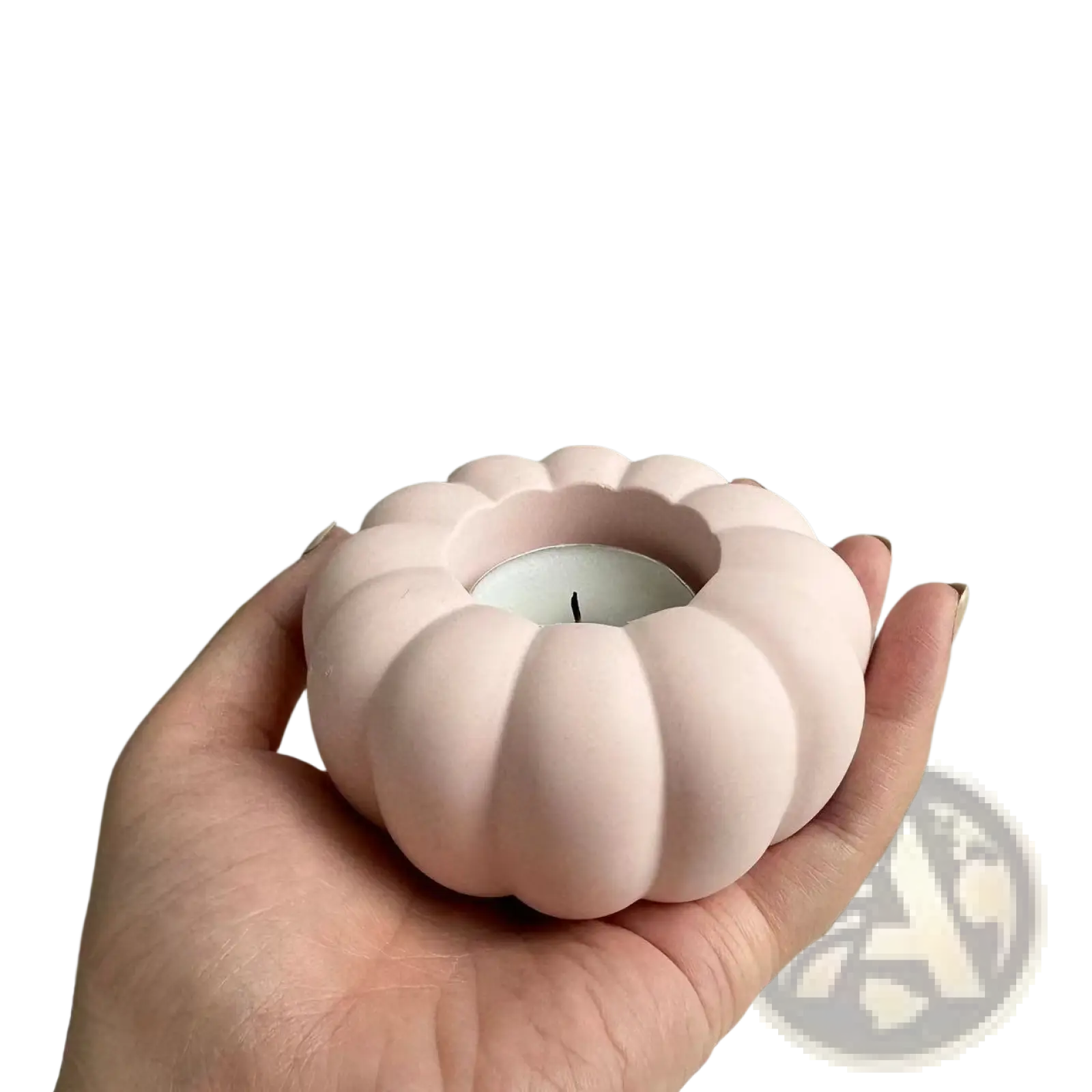 A soft pink ceramic pumpkin-shaped candle holder with smooth matte finish from Pumpkin Candle Holder Silicone Mold T289