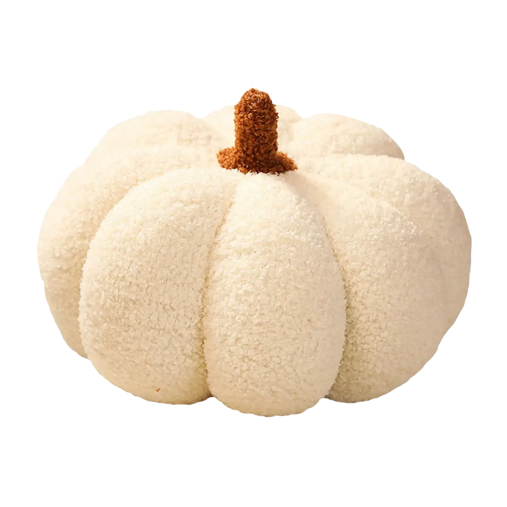 Cream-colored plush pumpkin throw pillow with textured fuzzy surface and brown tufted stem for halloween decor