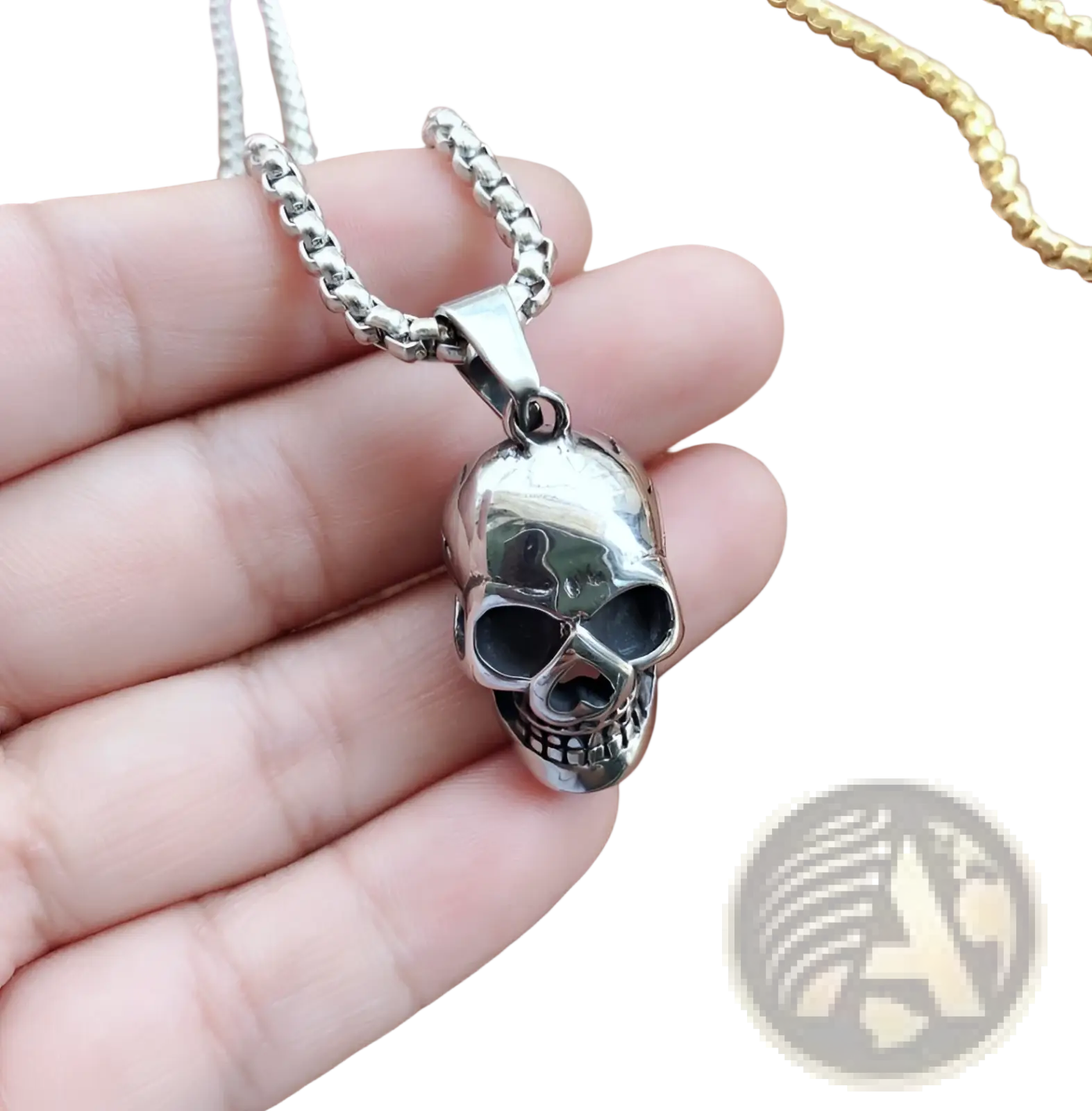 Silver skull pendant with polished reflective finish and detailed facial features on a matching titanium steel chain