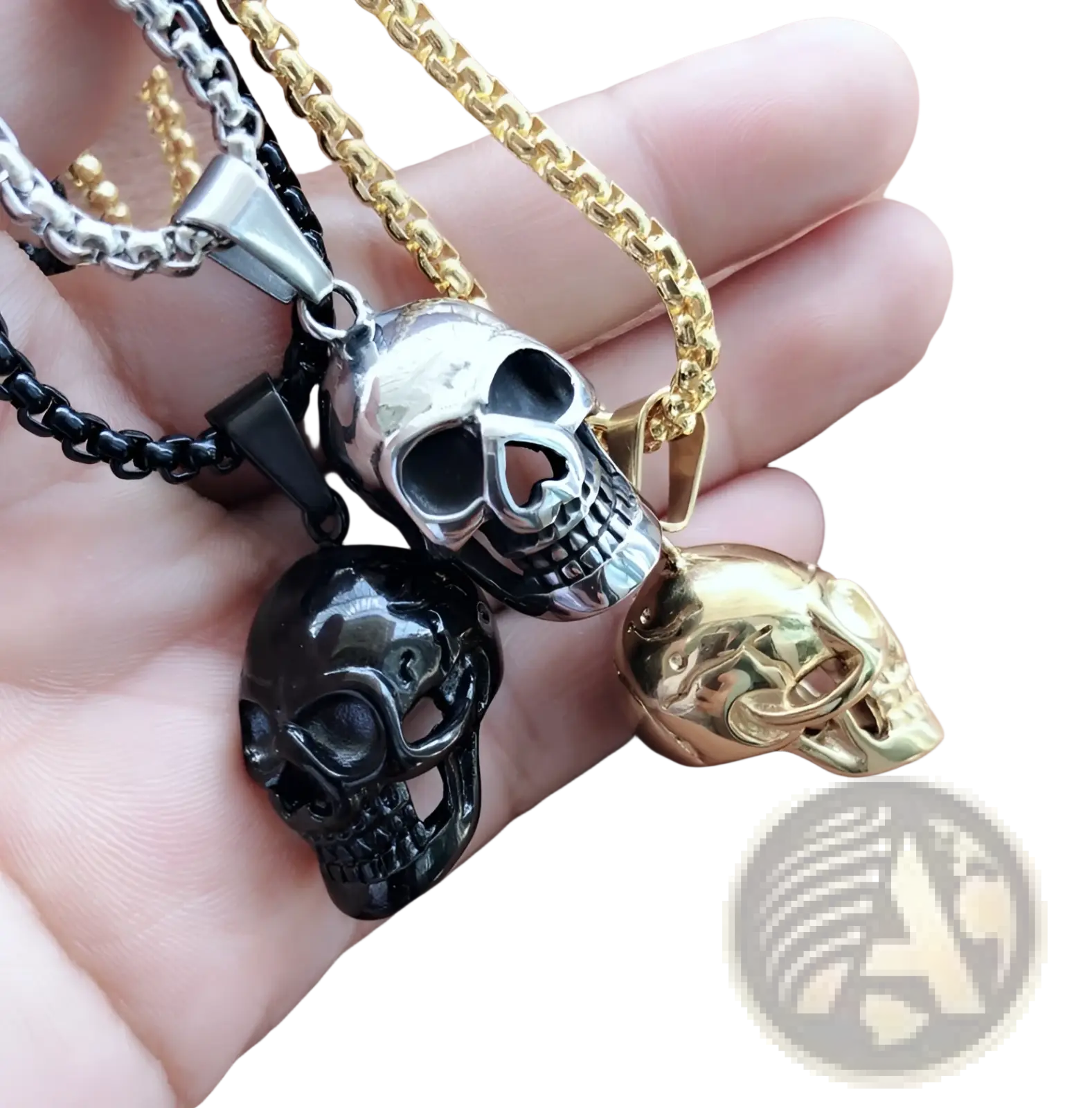 Three skull-shaped pendant necklaces in silver black and gold titanium steel with detailed engravings for men and women