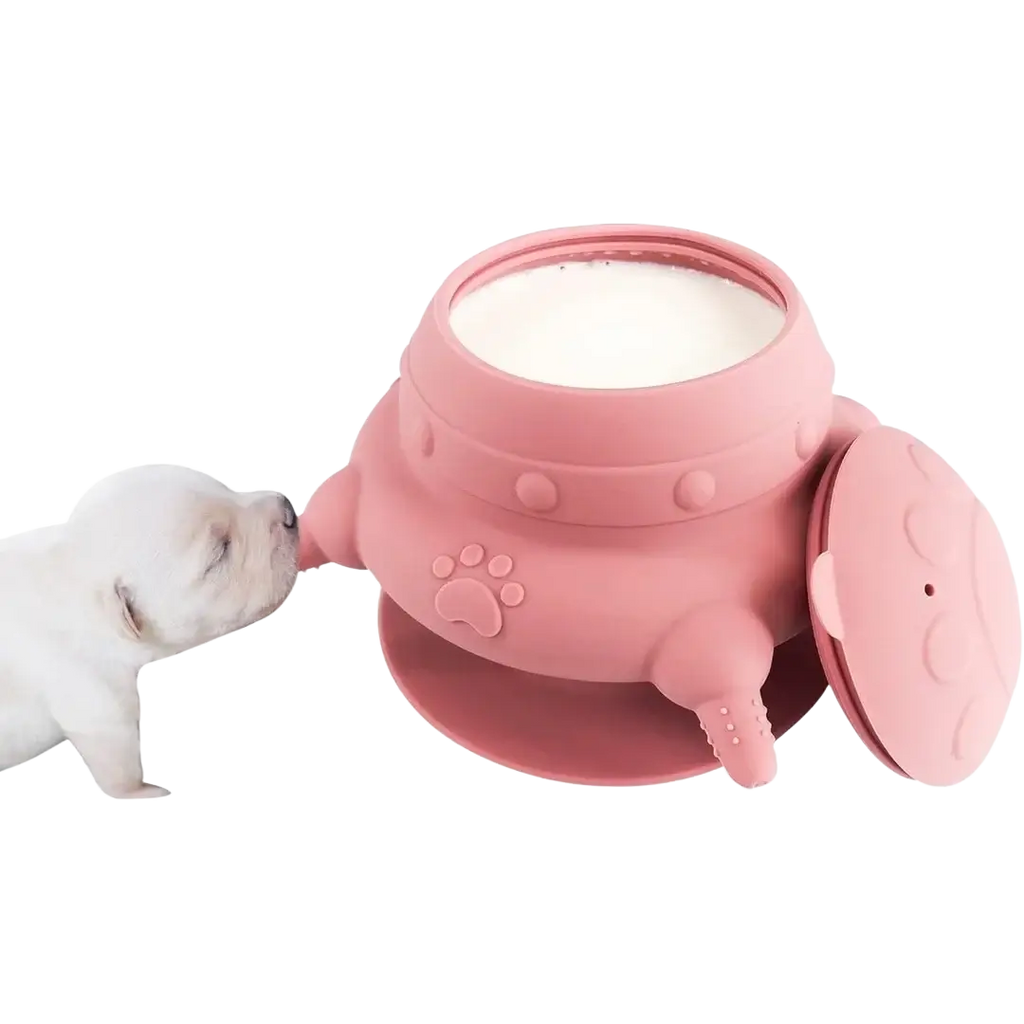 Pink silicone puppy milk feeder bowl with four nipples paw print design and suction base for easy use
