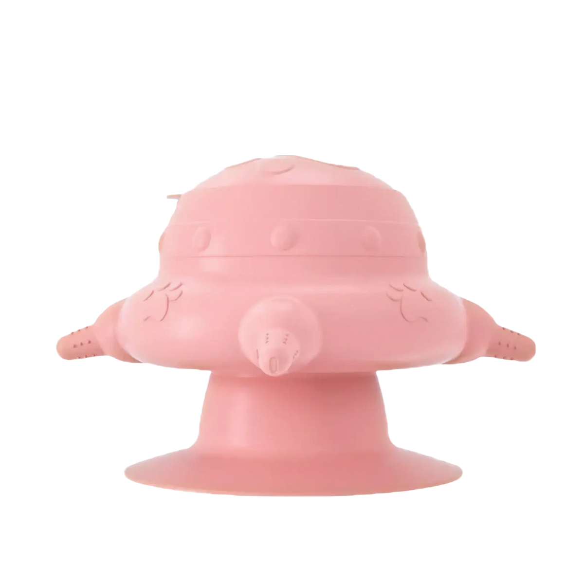 Pink silicone puppy milk feeder shaped like a rounded spaceship with wing-like appendages and a central nozzle