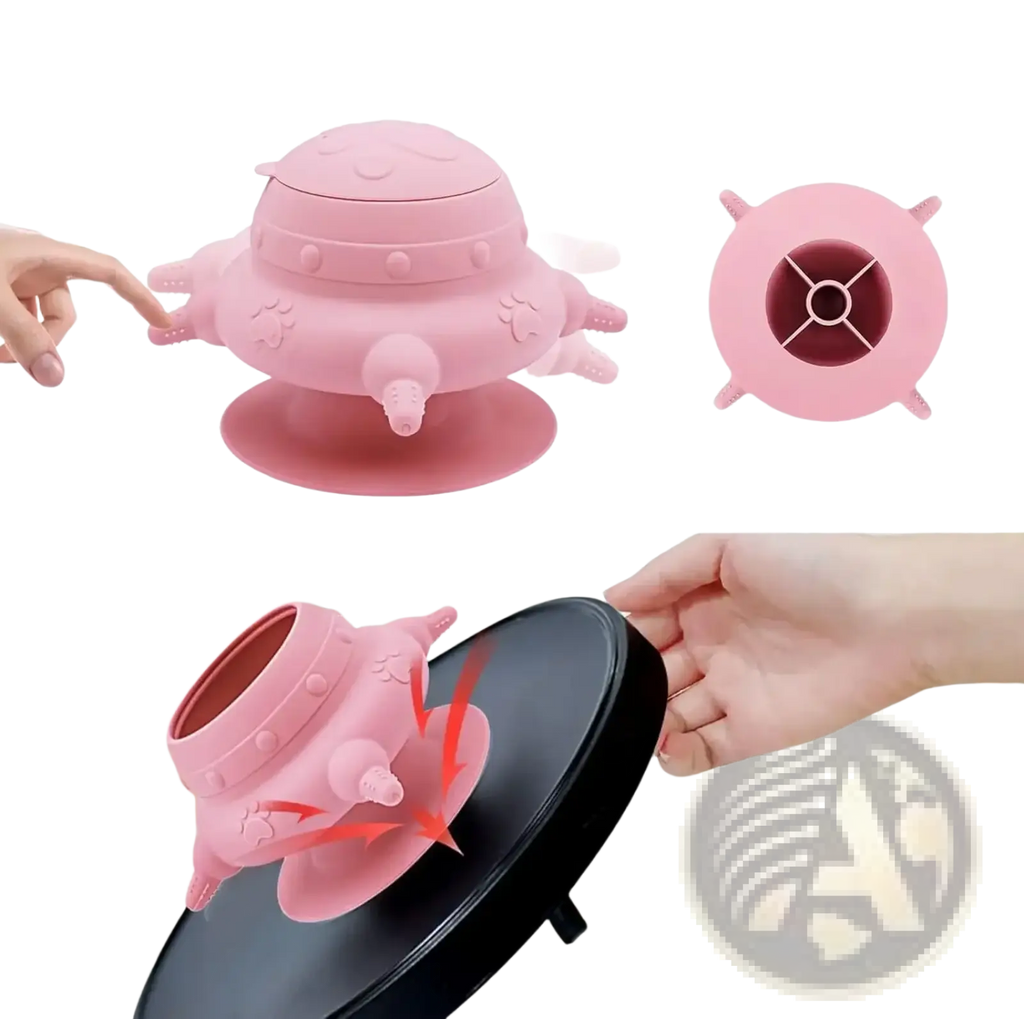 Pink silicone puppy milk feeder ufo shaped bowl with suction cup base and paw print detailing