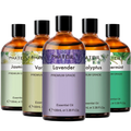 Set of five amber glass bottles of pure essential oil with black caps labeled phatoil for aromatherapy fragrance use