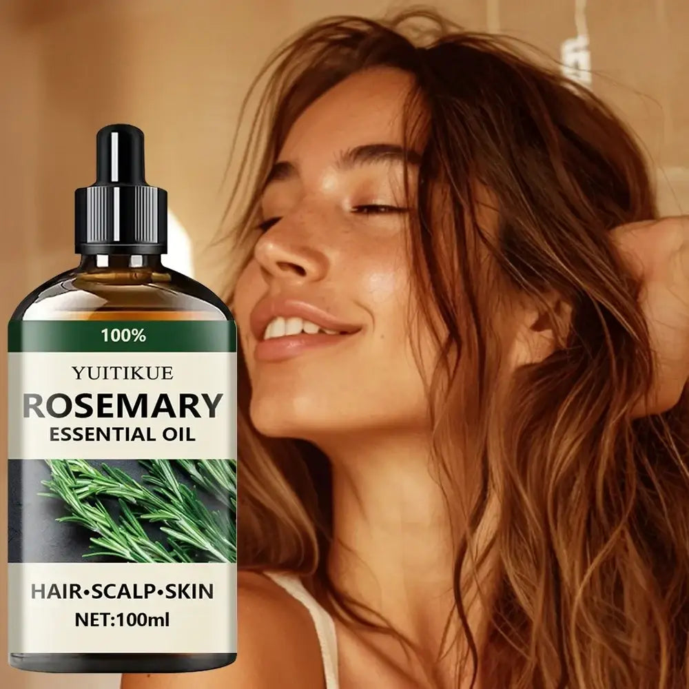 A dark amber glass bottle with black dropper cap labeled yuitikue pure rosemary essential oil for hair scalp and skin