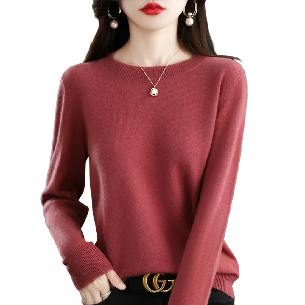A soft dusty rose long-sleeved pure wool cashmere o-neck pullover sweater with ribbed cuffs and round neckline