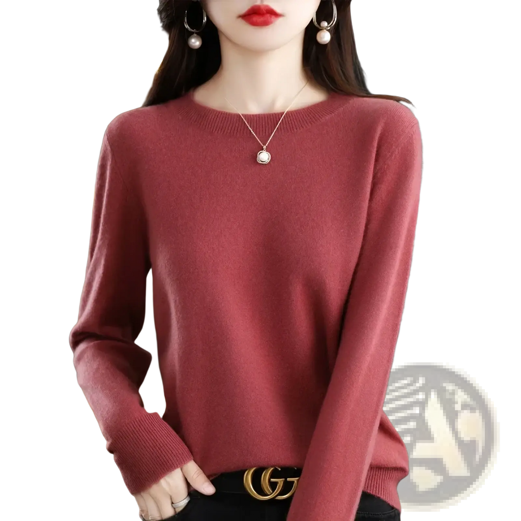 A soft dusty rose pure wool cashmere long-sleeved o-neck sweater for women with ribbed cuffs