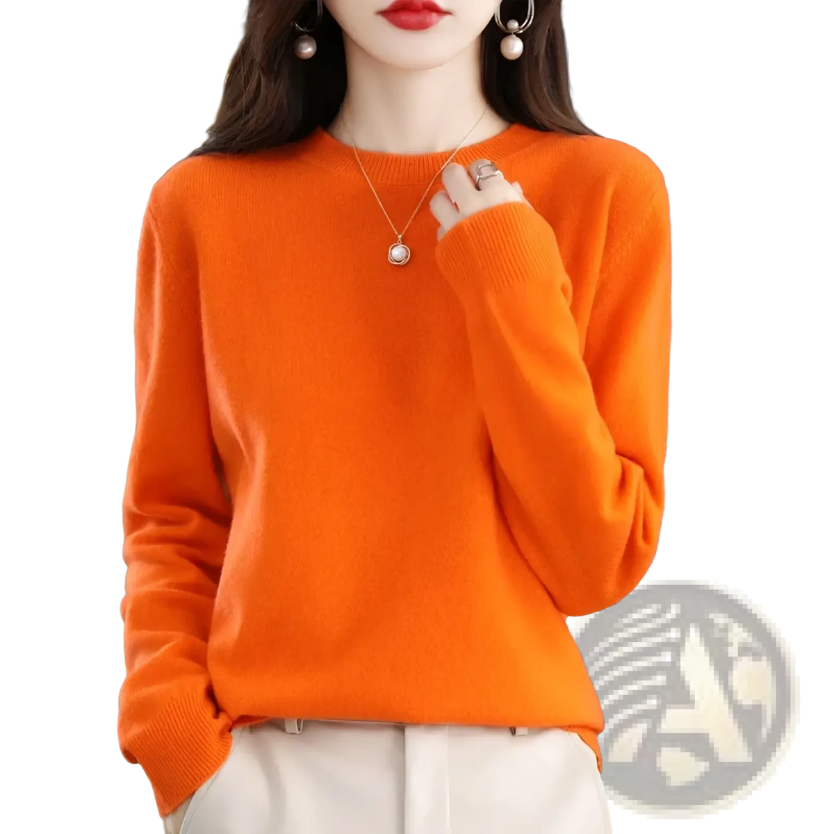 A vibrant orange pure wool cashmere o-neck sweater for women with soft texture and ribbed cuffs