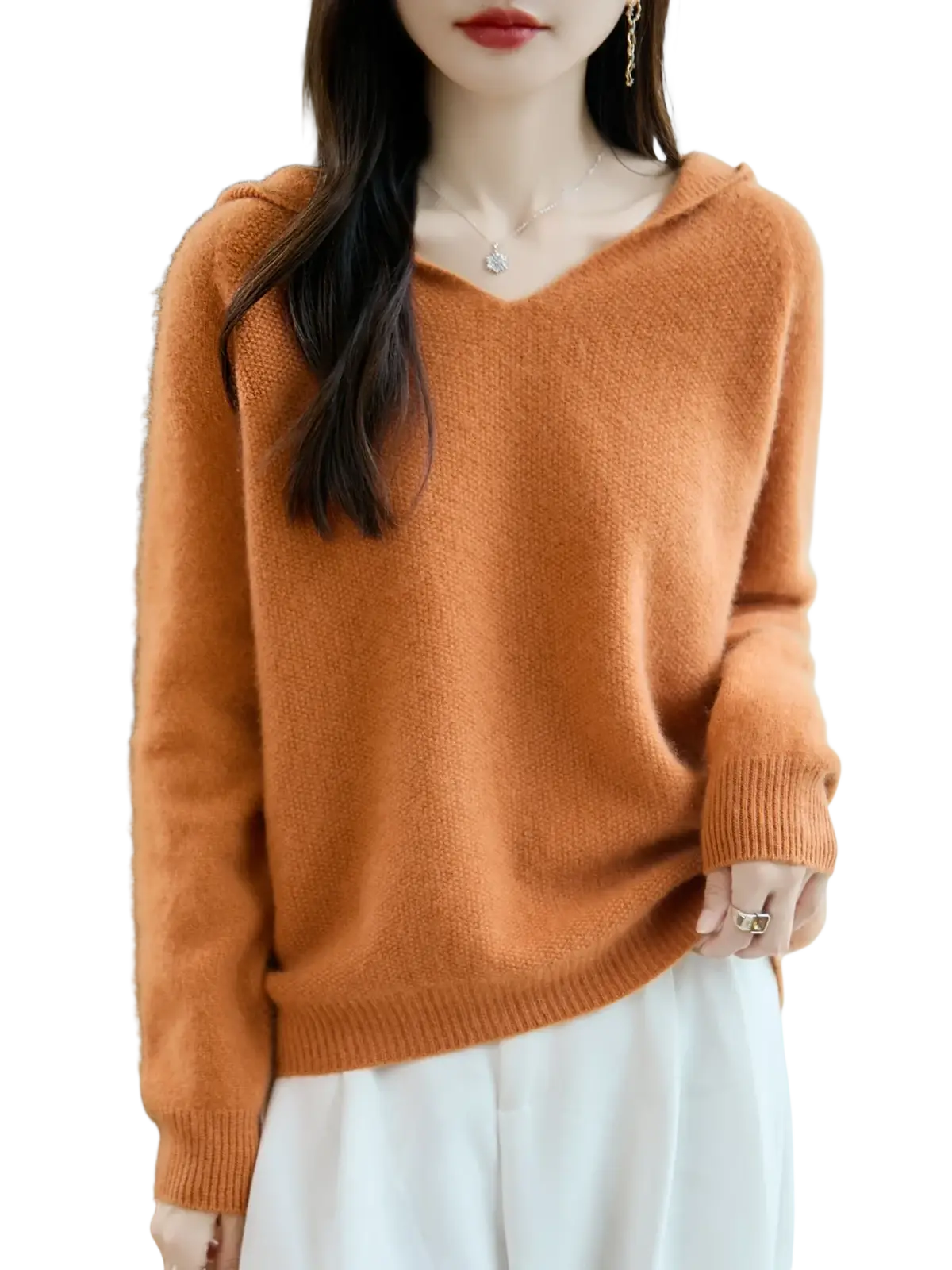 A cozy rust-orange pure wool hooded pullover sweater with soft knit texture and ribbed cuffs