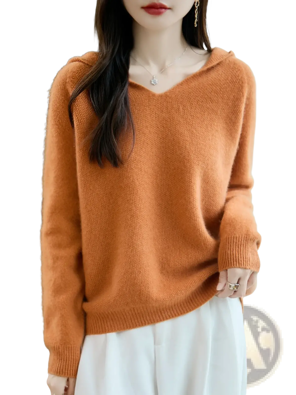 A cozy rust-orange pure wool hooded pullover sweater with soft knit texture and ribbed cuffs