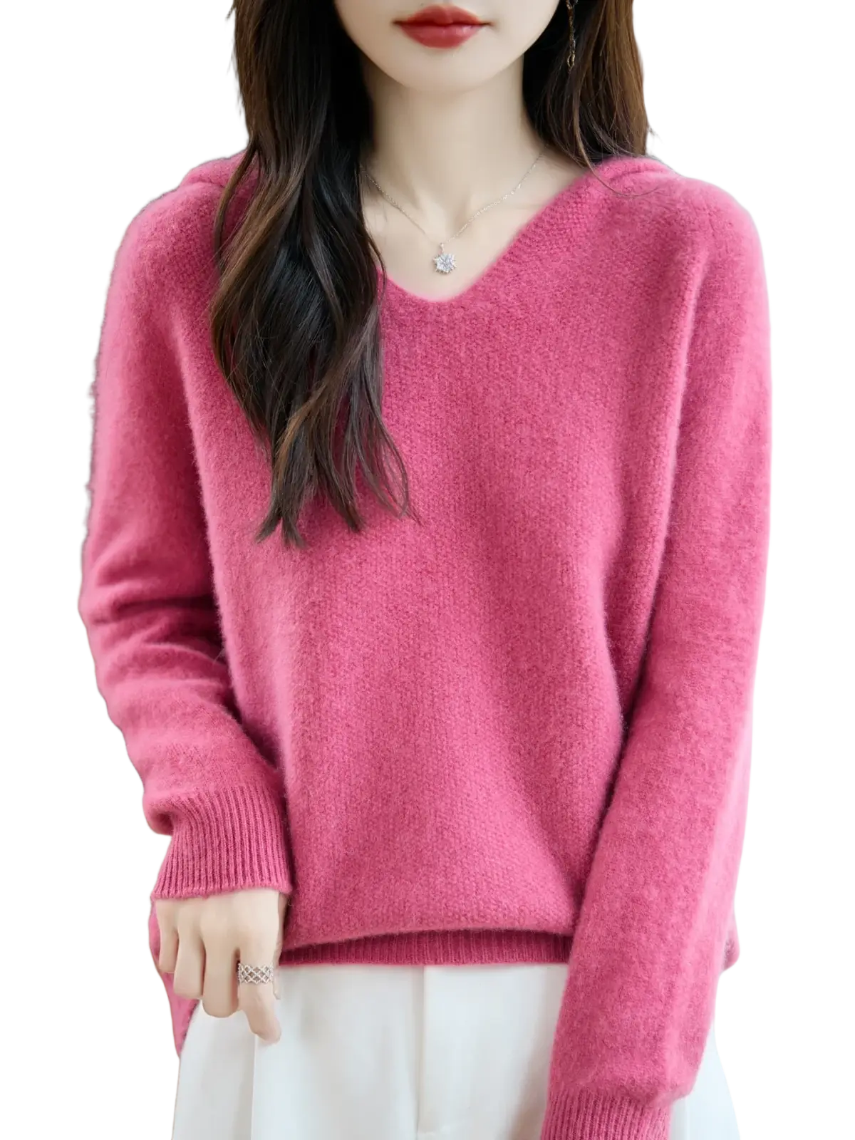 A soft dusty rose pure wool hooded pullover sweater with a v-neckline and ribbed cuffs