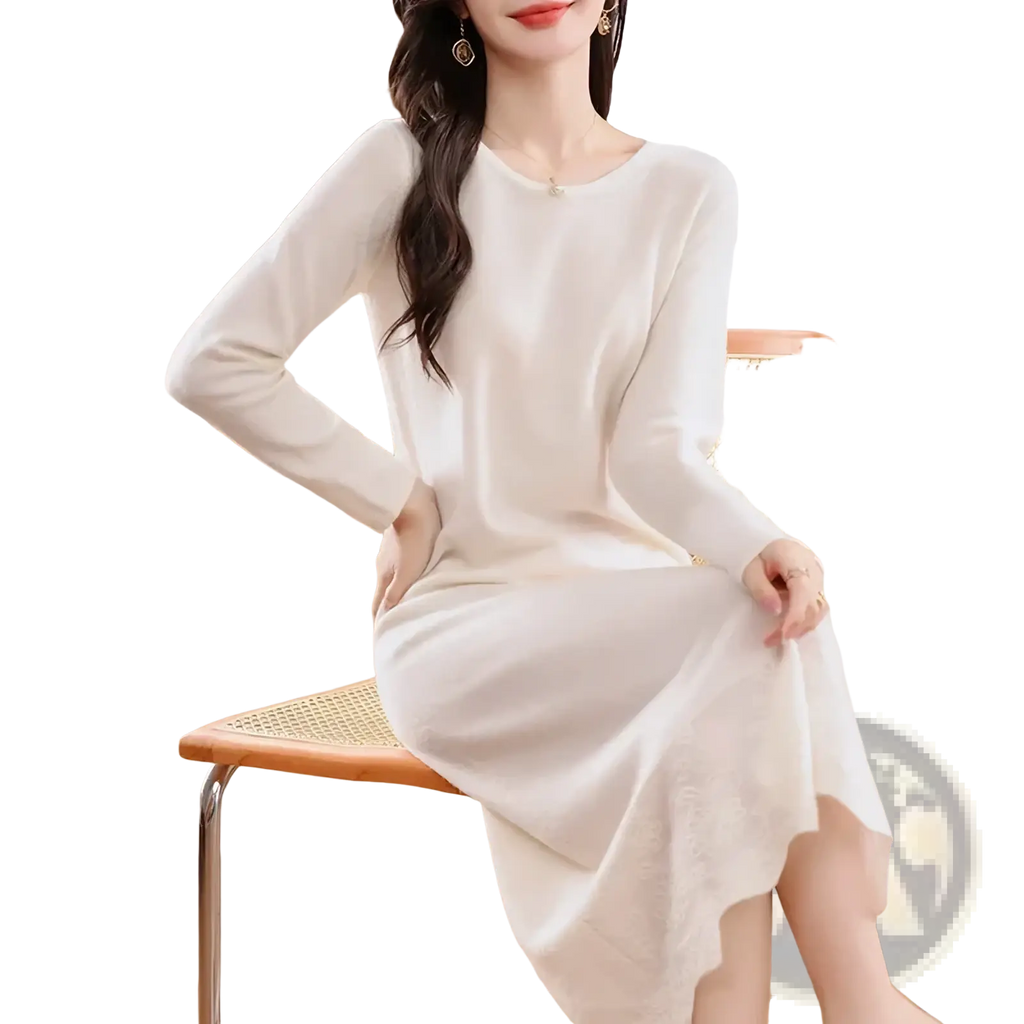 A soft off-white pure wool knit midi dress with long sleeves round neckline and asymmetrical hemline