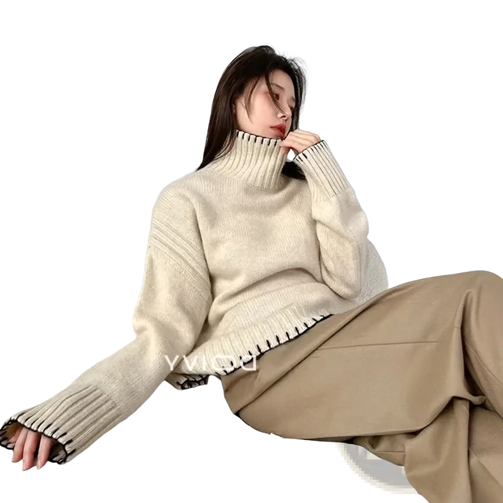 Cream-colored pure wool turtleneck sweater women loose knit pullover with ribbed texture and black trim on cuffs and hem