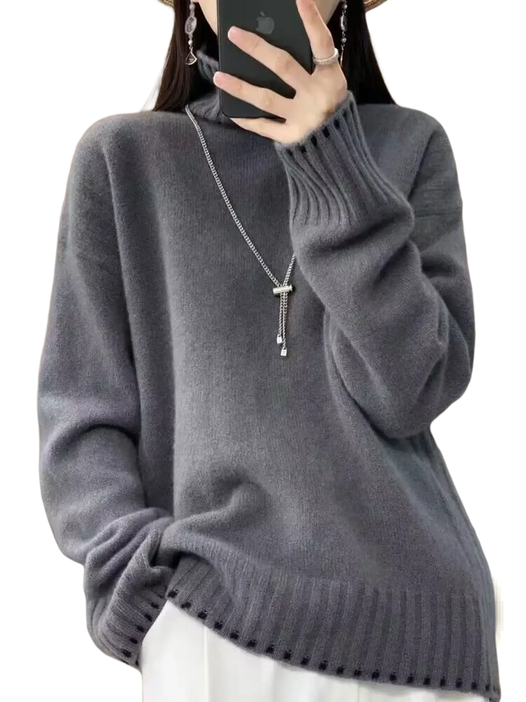 A soft heather gray pure wool turtleneck sweater for women with ribbed cuffs and hem in a loose knit pullover design