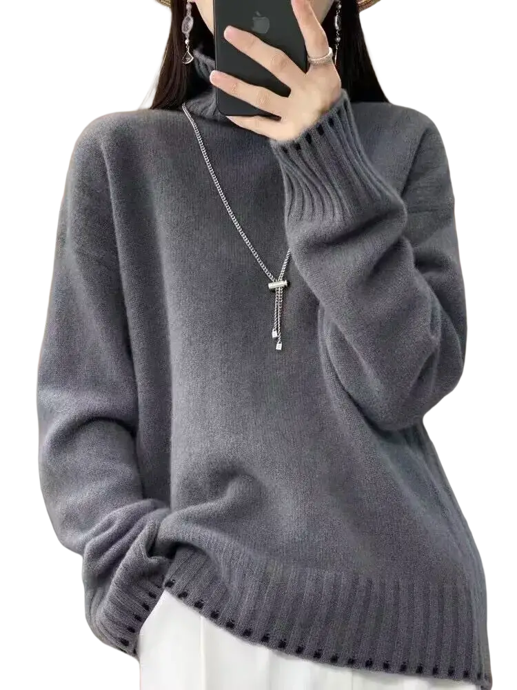 A soft heather gray pure wool turtleneck sweater for women with ribbed cuffs and hem