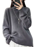 A soft heather gray pure wool turtleneck sweater for women with ribbed cuffs and hem